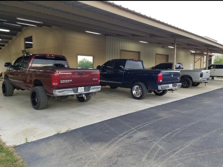 Dodge Ram Cummins trucks lined up at the CA Tuning shop